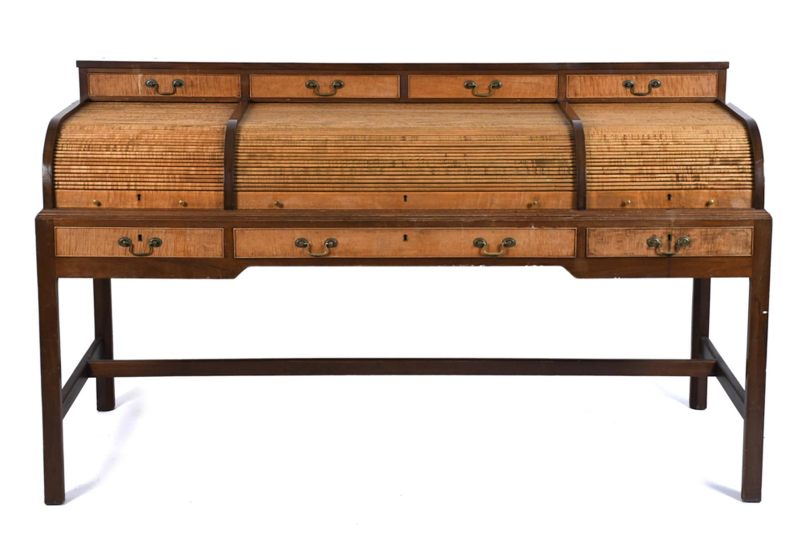 GOOD 20TH C. MAHOGANY AND MAPLE DESK.: A custom vintage mahogany roll top desk, with a mahogany case, and unique tiger maple retracting tambour roll top, with a fitted interior, with three drawers in apron and three drawers in deck