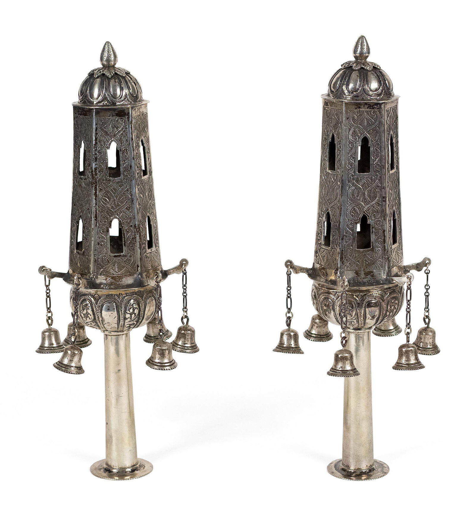 PR. CONTINENTAL SILVER TORAH FINIALS.: A pair of antique continental silver (800 or similar purity) Torah finials, or rimonim, each of tall hexagonal architectural form with pierced arched openings, densely chased foliate and geometric