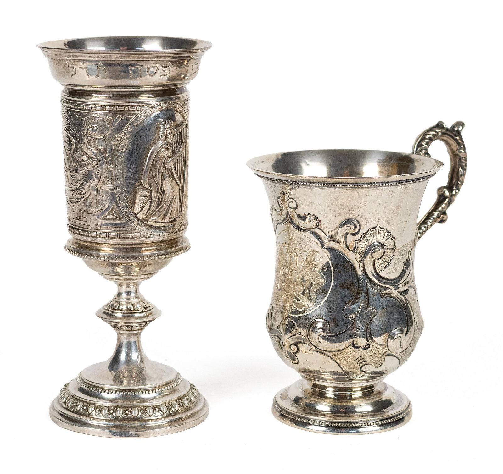 TWO SILVER JUDAICA KIDDUSH CUPS.: Two silver Judaica Kiddush cups, the goblet decorated in relief with a figure of King David playing the harp, Hebrew writing on rim, surrounded by scrolling foliate ornament, raised on pedestal base, 
