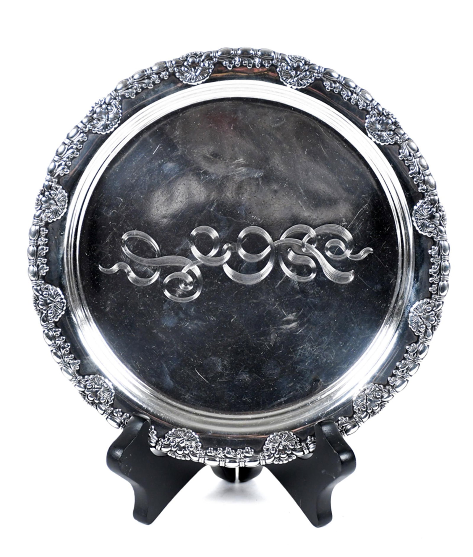 VINTAGE TIFFANY & CO. STERLING DISH.: A Tiffany & Co. sterling silver circular footed dish, stamped on underside TIFFANY & Co / 3765M 1988 / STERLING, with a repousse acanthus leaf and floral border and an engraved script monogram to the