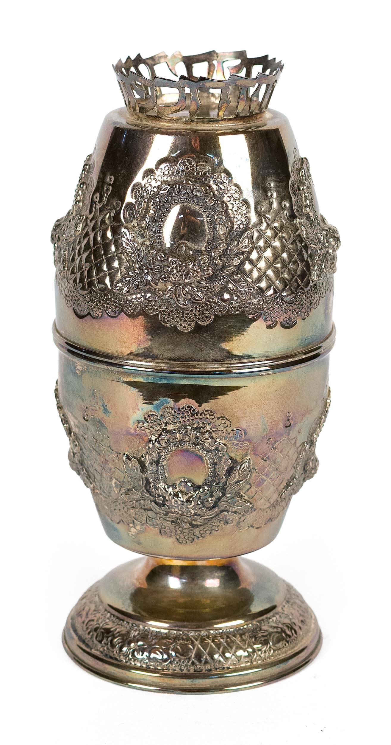 JUDAICA STERLING SILVER ETROG BOX.: A Judaica stamped stelring silver Etrog box, of tall urn or egg form with removable cover, decorated with repoussé floral and lattice ornament and raised oval cartouches, surmounted by a pierced