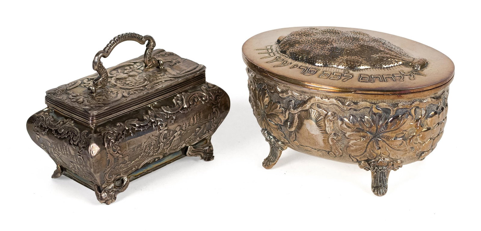 TWO JUDAICA SILVER BOXES.: Two Judaica silver boxes, including an oval footed etrog box with hinged cover embossed with Hebrew inscription the sides decorated with repoussé floral ornament, marked 835, 5.5”L; with a