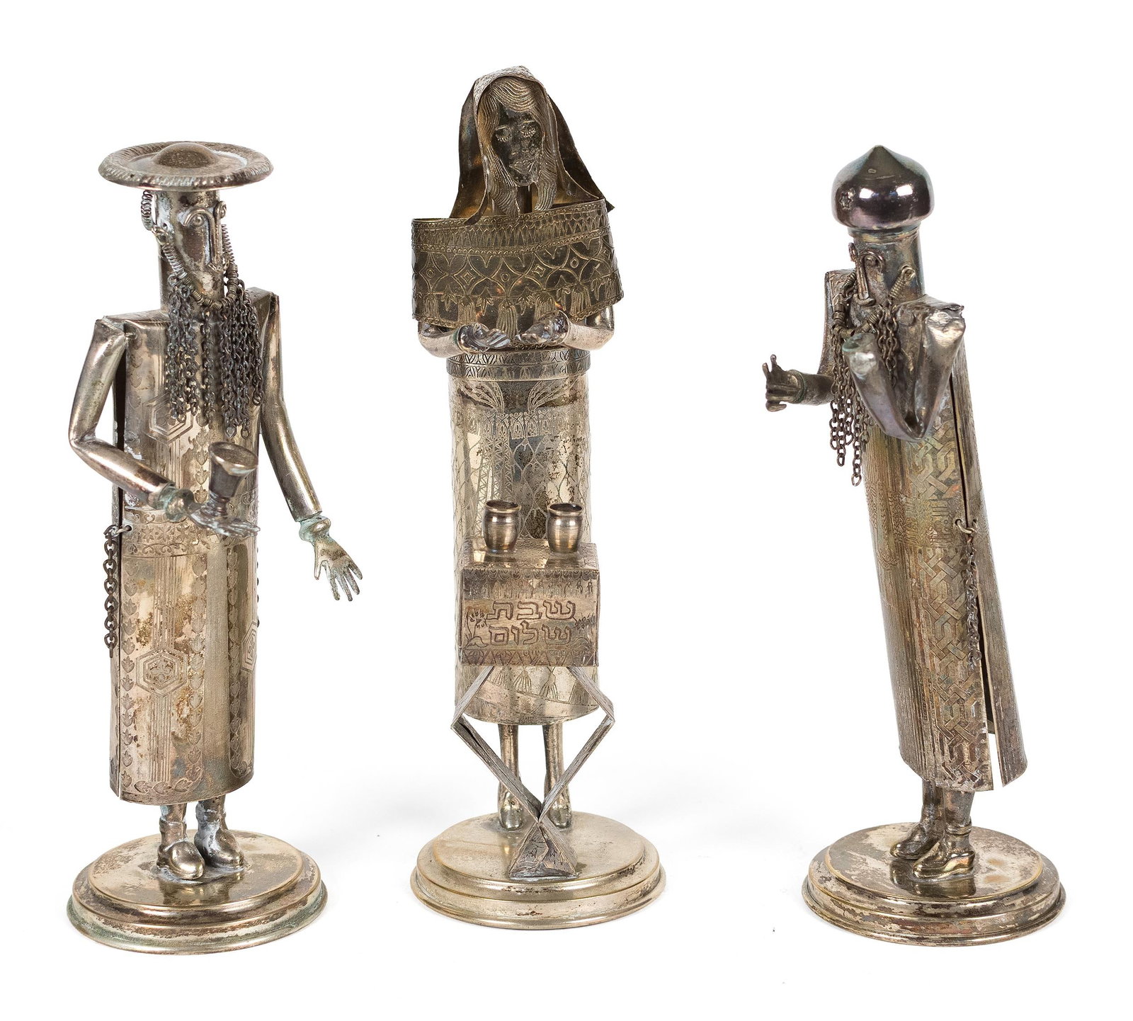THREE S. OHANA JUDAICA SILVER FIGURES.: Three S. Ohana, Jerusalem, silver Judaica figural sculptures, each of elongated stylized form and raised on a circular base. With a swaying/bobbing mechanism. Three standing figures, two wit hcaps