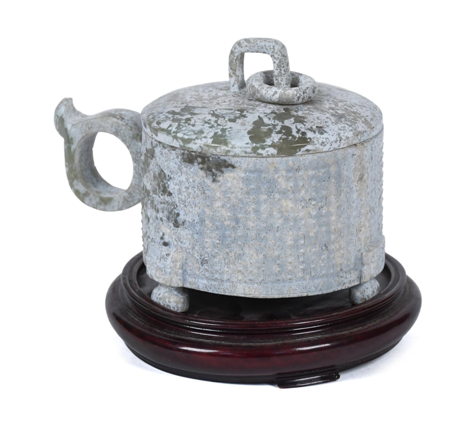 ANTIQUE CHINESE ARCHAISTIC LIDDED JADE VESSEL.: An antique Chinese archaistic calcified jade lidded vessel in the manner of archaic ritual forms, with a heavily encrusted grey-green patinated surface throughout. The domed lid fitted with a square-f