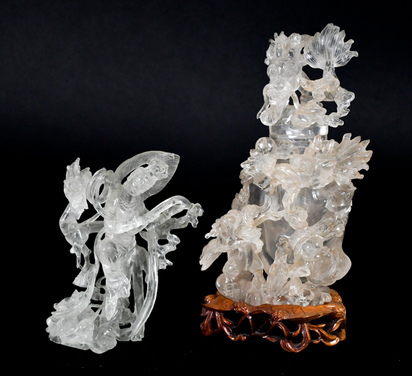 TWO ANTIQUE CHINESE ROCK CRYSTAL CARVINGS, 2PCS.: A collection of two antique Chinese rock crystal carvings, including: a covered dragon jar profusely carved with an ascending dragon among clouds and lotus blooms, on a carved wood stand, 8”H;a 