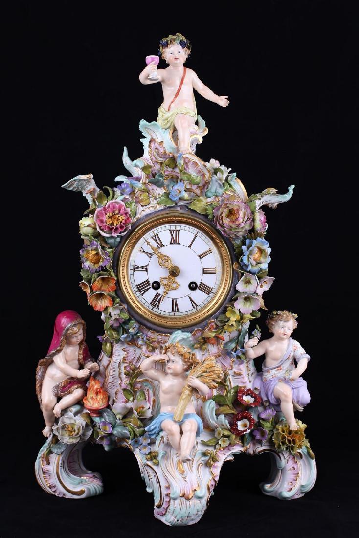 Mantel clock with a multi-figure statuary group. Late: Mantel clock with a multi-figure statuary group. Late XIX century. Germany. Meissen porcelain manufactory. Porcelain, gilding, polychrome painting. Size - 47 cm. Blue mark - crossed swords.