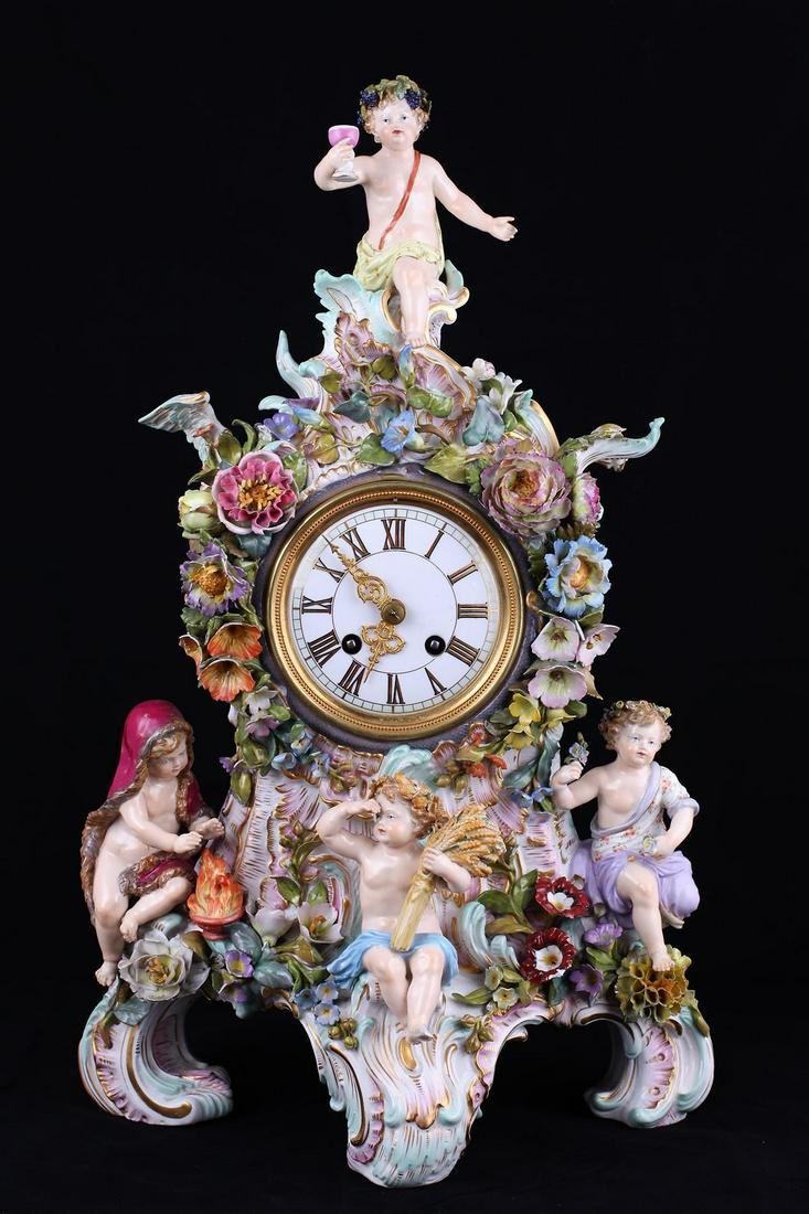 Mantel clock with a multi-figure statuary group. Late: Mantel clock with a multi-figure statuary group. Late XIX century. Germany. Meissen porcelain manufactory. Porcelain, gilding, polychrome painting. Size - 47 cm. Blue mark - crossed swords.