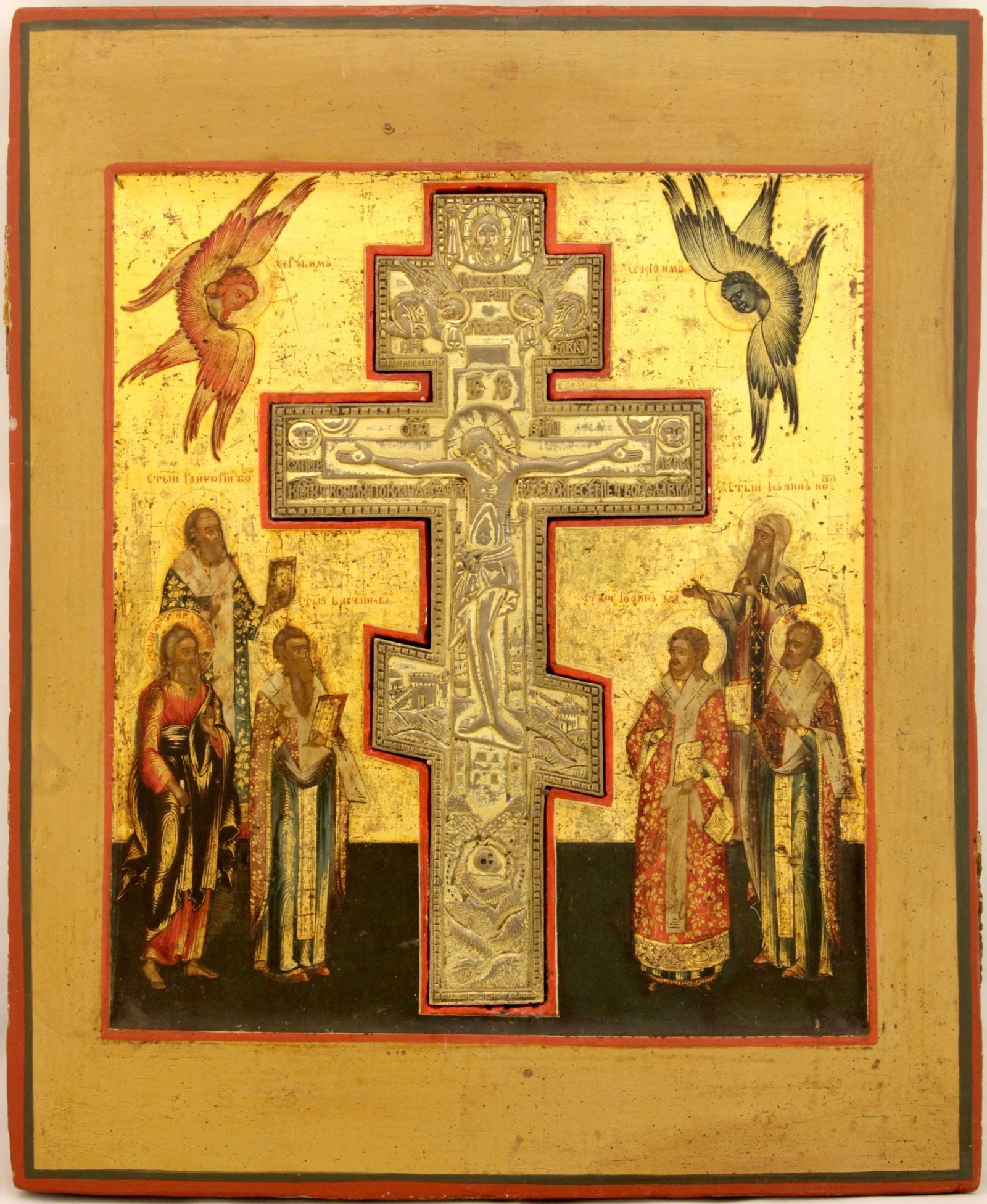 ['Staurothek']. Russian icon "Crucifixion" with selected saints. - Russia, 19th century. - 40x33 cm.: ['Staurothek']. Russian icon "Crucifixion" with selected saints. - Russia, 19th century. - 40x33 cm. Tempera on wood; levkas, gilding. A brass crucifix inset into the panel.