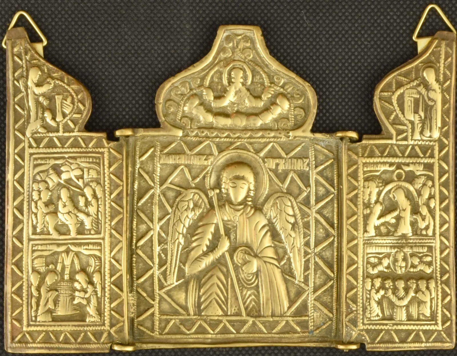 Russian 3-partie folding icon ('skladen') "Saint Archangel Michael with Festivals". - Russia, 19th: Russian 3-partie folding icon ('skladen') "Saint Archangel Michael with Festivals". - Russia, 19th century. - 14x11 cm. Brass; gilding. Cast in relief.