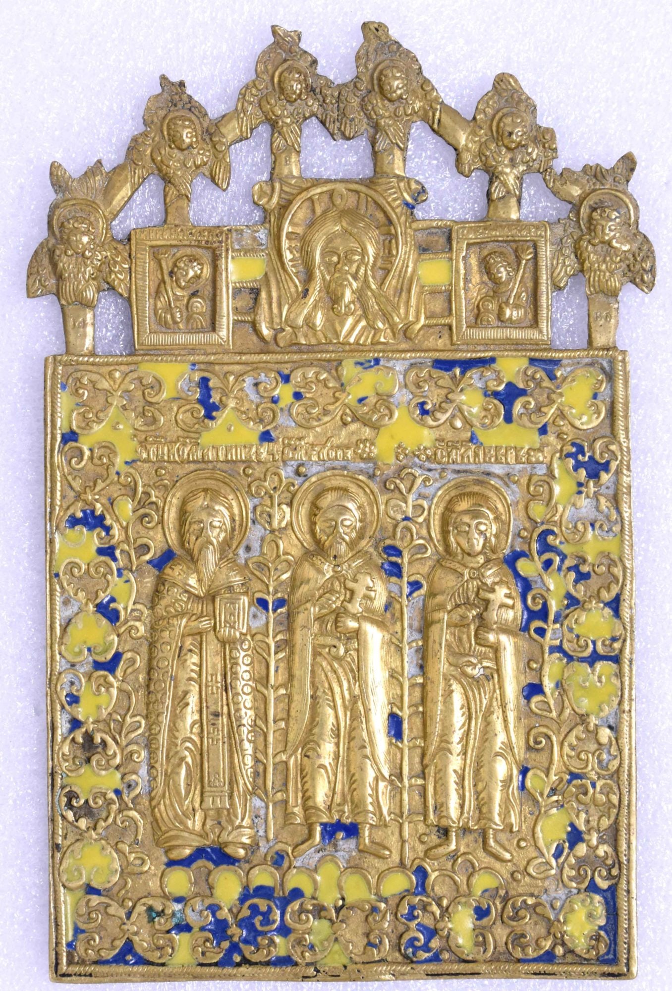 Russian icon "Saint Martyr Antipiy, Saints Florus and Lauros". - Russia, 19th century. - 15x9 cm.: Russian icon "Saint Martyr Antipiy, Saints Florus and Lauros". - Russia, 19th century. - 15x9 cm. Brass; gilding. Cast in relief. Enamels (3 colours).
