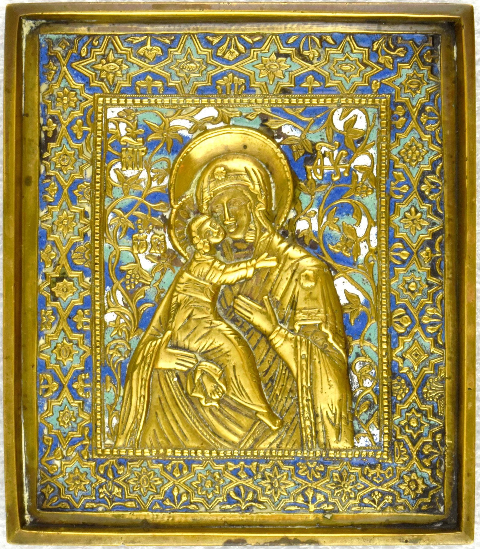 Russian icon "Our Lady of Vladimir". - Russia, 19th century. - 13x12,5 cm.: Russian icon "Our Lady of Vladimir". - Russia, 19th century. - 13x12,5 cm. Brass; gilding. Cast in relief. Enamels (3 colours).
