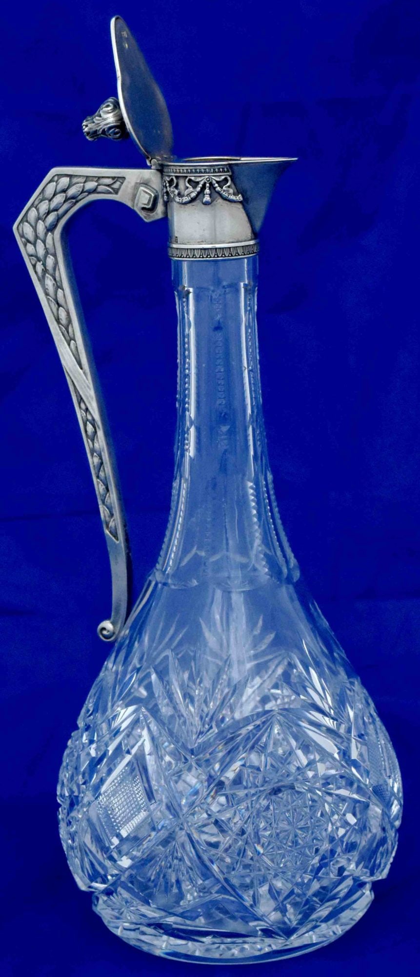 [Russia]. Crystal carafe with the silver lid. - Russia, 19-20th century. - 24x9 cm.: [Russia]. Crystal carafe with the silver lid. - Russia, 19-20th century. - 24x9 cm. Crystal; carving. Silver; casting, minting, mounting. Hallmark of .84 fineness, "15A" (?).