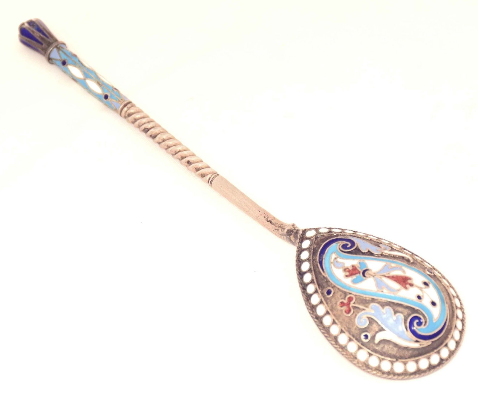 [Russian]. Silver spoon with enamels. - Russia, 20th century. -14x3 cm. Weight: 28 g.: [Russian]. Silver spoon with enamels. - Russia, 20th century. -14x3 cm. Weight: 28 g. Silver; casting, multicolor enamels, gilding. Hallmarks: master's mark, "84", "head in kokochnik to the right", "8