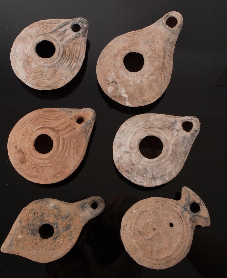 GROUP OF 6 ANCIENT ROMAN CLAU OIL LAMP: .