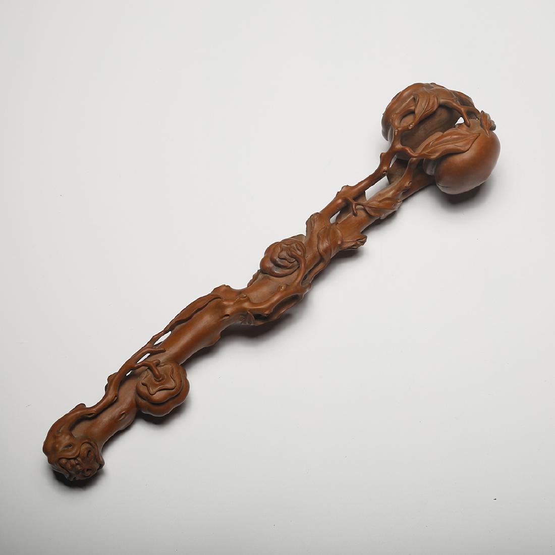 CHINESE CHENXIANG WOOD RUYI: Length: 12.6 inches. Width: 4.8 inches. Height: 4.2 inches. Length: 32cm Width: 12.1cm Height: 10.6cm Weight: 167.3g Provenance: From the collections of Mr. AtsukoÂ Jerrie estates from Rochester, NY