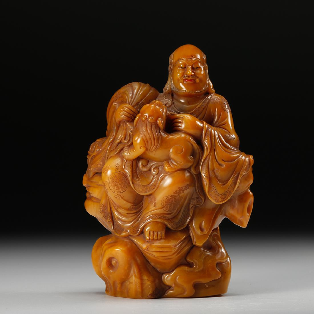 CHINESE TIANHUANG SOAPSTONE CARVED LOHAN: Height: 4.9 inches. Width: 3.5 inches. Thickness: 2.1 inches. Height: 12.5cm Width: 9cm Thickness: 5.4cm Weight: 608g Provenance: From the collections of Mr. AtsukoÂ Jerrie estates from Rochester, N