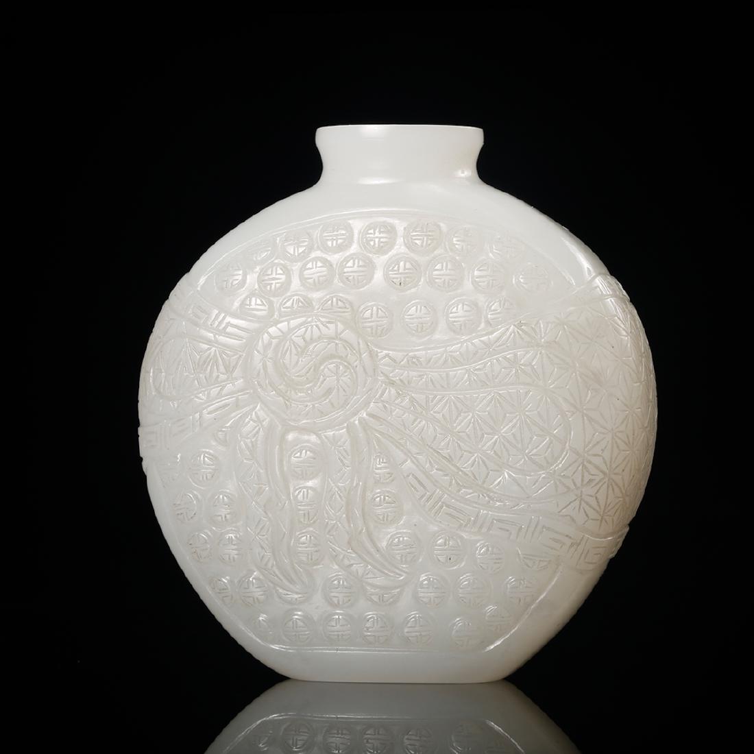 CHINESE WHITE JADE SNUFF BOTTLE: Height: 2 inches. Width: 1.9 inches. Thickness: 0.7 inches. Height: 5.2cm Width: 4.9cm Thickness: 1.9cm Weight: 63.5g Provenance: From the collections of Mr. Chow estates from Boston, MA.