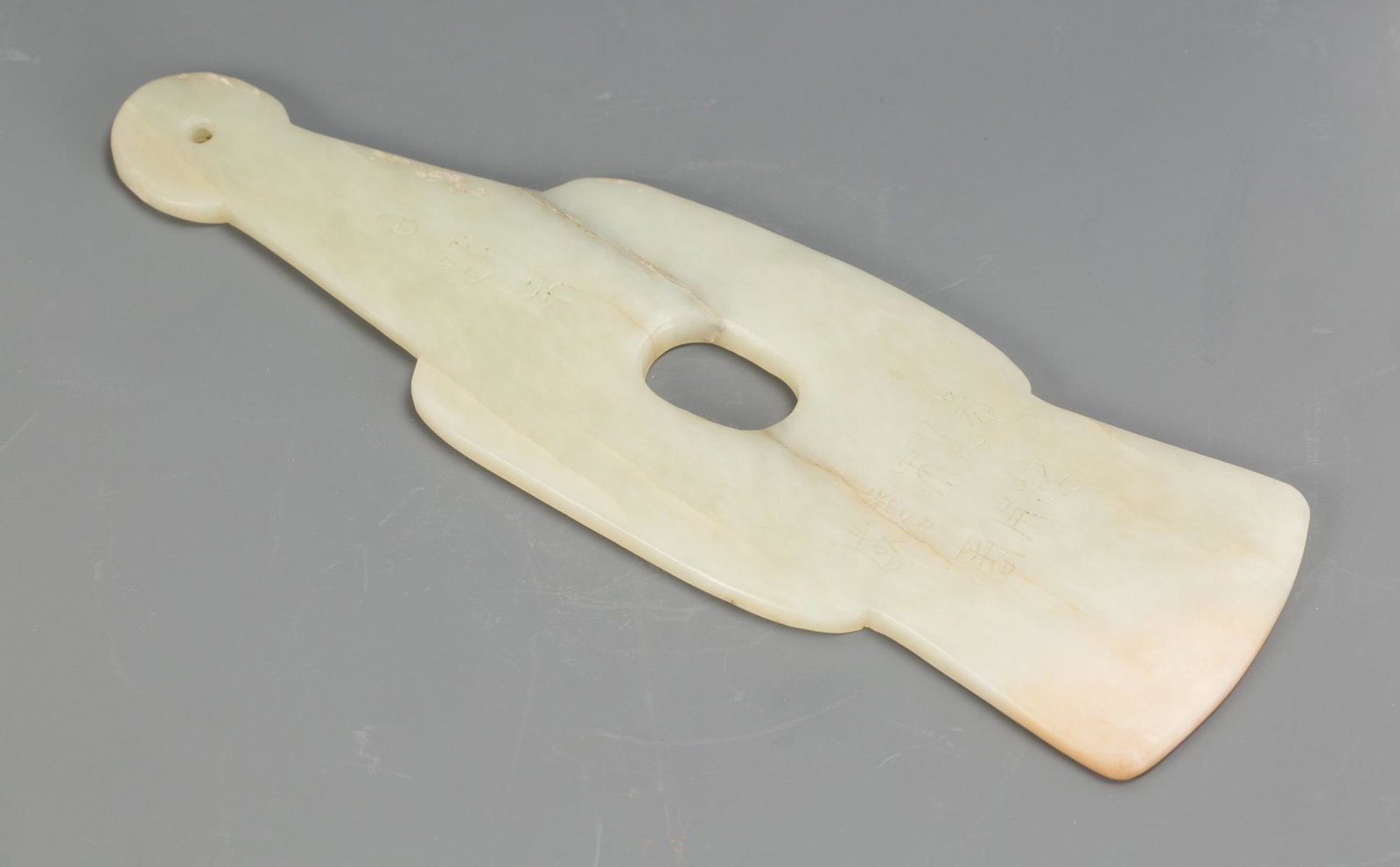 A CHINESE JADE AX WITH ENGRAVINGS (1 of 4)