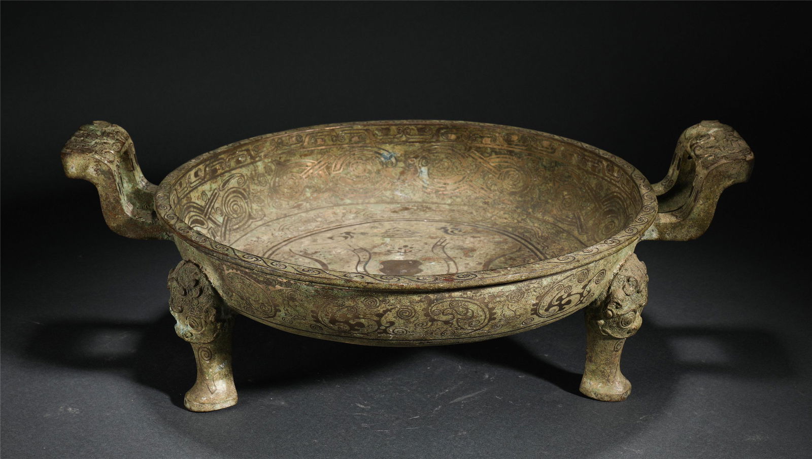 Chinese Inlaid Gold Beast Pattern Triple Footed Bronze: Chinese Inlaid Gold Beast Pattern Triple Footed Bronze Dish. Height: 7.1 inches. Length: 20.9 inches. Diameter: 15.4 inches. Height: 18cm Length: 53cm Diameter: 39cm Weight: 4940g