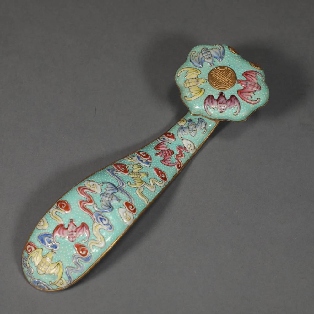 A FAMILLE ROSE CLOUD AND BAT PORCELAIN RUYI: A FAMILLE ROSE CLOUD AND BAT PORCELAIN RUYI. Length: 7.5 inches. Length: 19cm