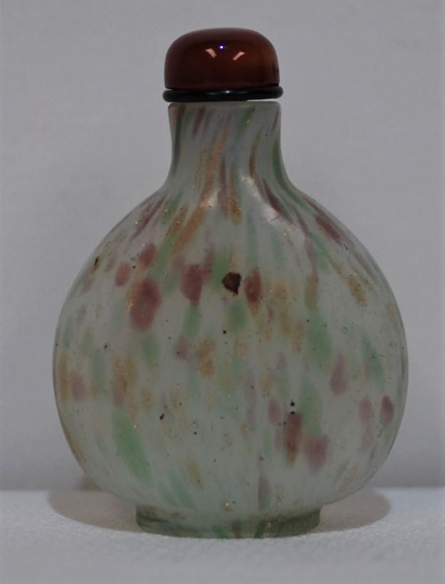 Ladies Milky White with Green, Lavender & Gold Flecking: According to the prior owner, this is a “rare ladies bottle.” The bottle is a milky white background with pale green, lavender and gold flecking. Brown glass top. This was purchased from Carey Sta