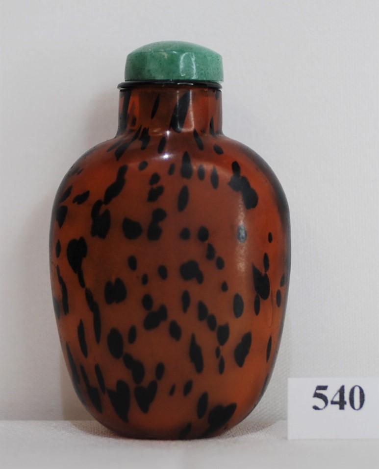 19th Century Chinese Brown Leopard Glass Snuff Bottle: This brown glass bottle has a leopard skin pattern in it. Green stopper with spoon. 2.5 x 1.75 inches. This was purchased from the Lotus Gallery Ann Arbor, Michigan on September 2, 1983 for $150. See 
