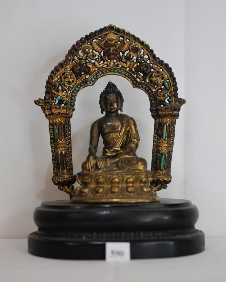 14th Century Tibetan Gilt Bronze Buddha Seated Under: This bronze Buddha and arch (inlaid mandala) sit on a wood base measuring: 7 in. overall, Buddha: 4 in. tall, base is 1.5 x 5 x 4 inches. This was originally acquired from Robert C. Eldered Co. Inc. E