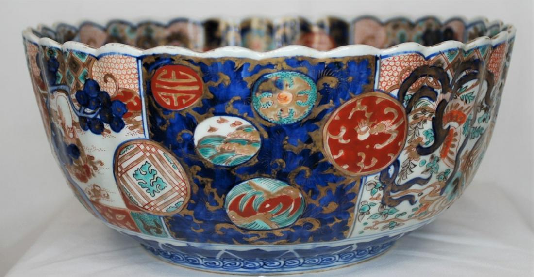 Antique Imari Bowl 13.25 in. circa 1840-1900: Bowl is 13.25 inches in diameter and 6 inches deep. It “has lovely ringing sound when struck.” This was brought back from Japan after WWII by a staff member of General MacArthur according to the n