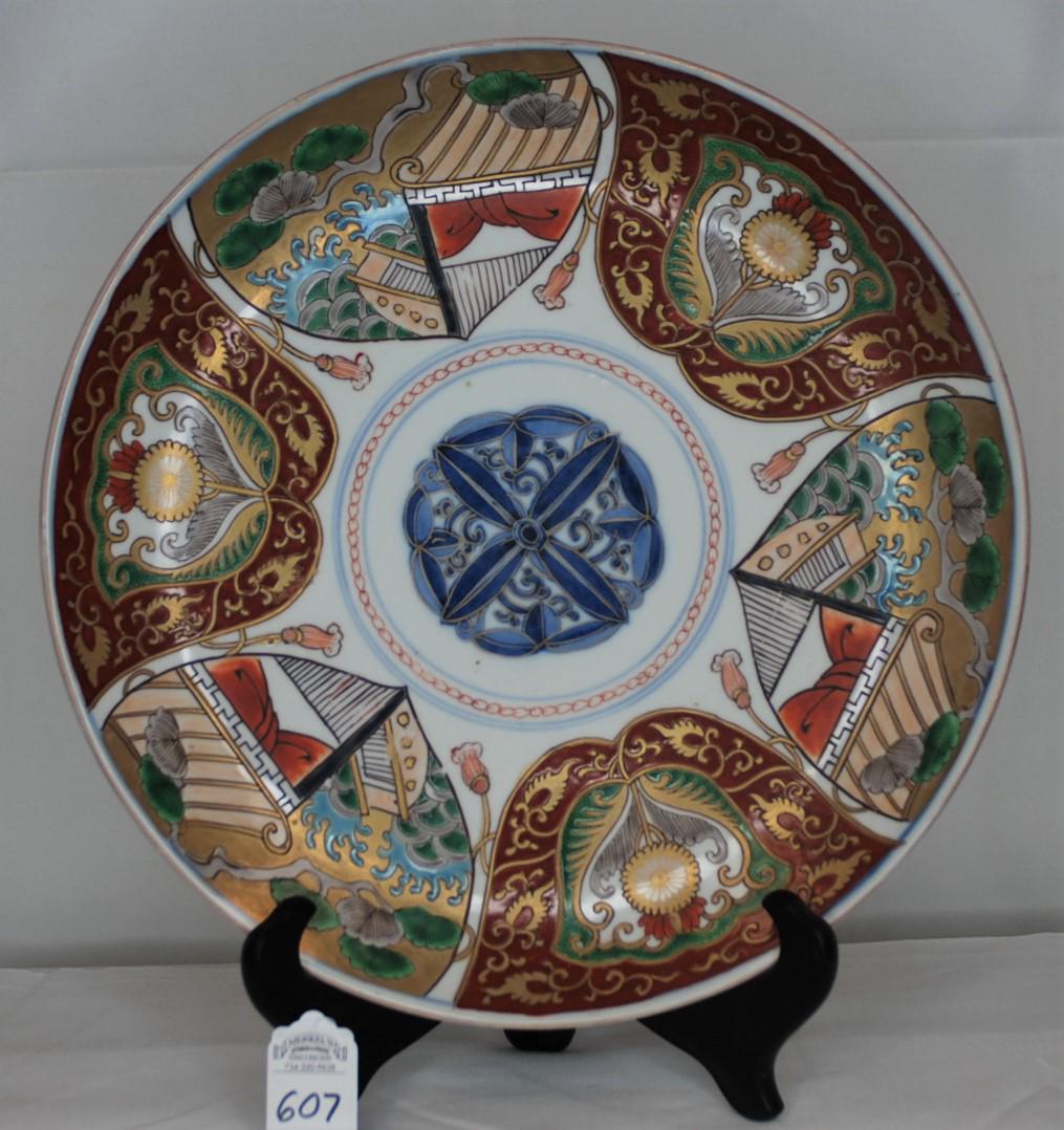 Antique Multicolored Japanese Imari Platter Early 1800s: This Imari plate was produced by potters prior to 1830 (middle Tokugawa era) at Imari, Kyushu, Japan. This old multicolor porcelain platter has vivid colors, blue and gold arabesque design on the cent