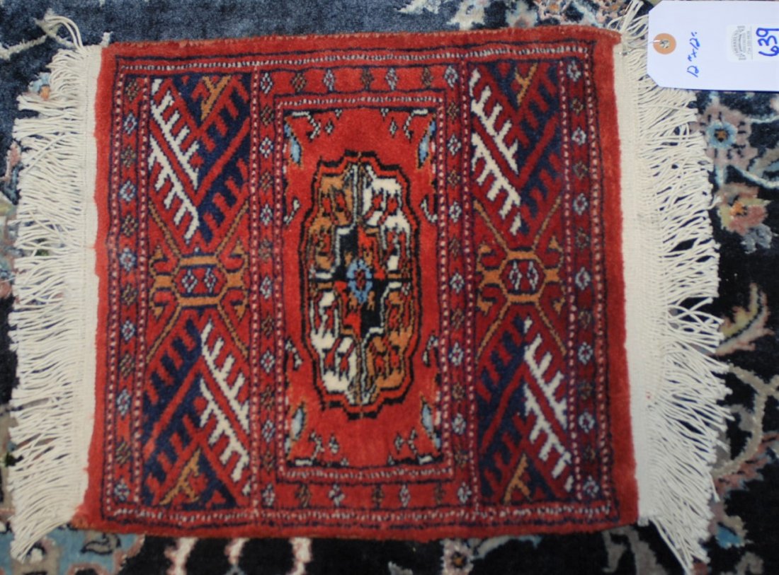 Oriental Mat in Bokhara Design 12 in x 12 in.: This Oriental mat is in a Bokhara design and measures 12 in. x 12. This was purchased at An Antique Shop in Melbourne, Australia in February 1978.Please view pictures for condition and detail.