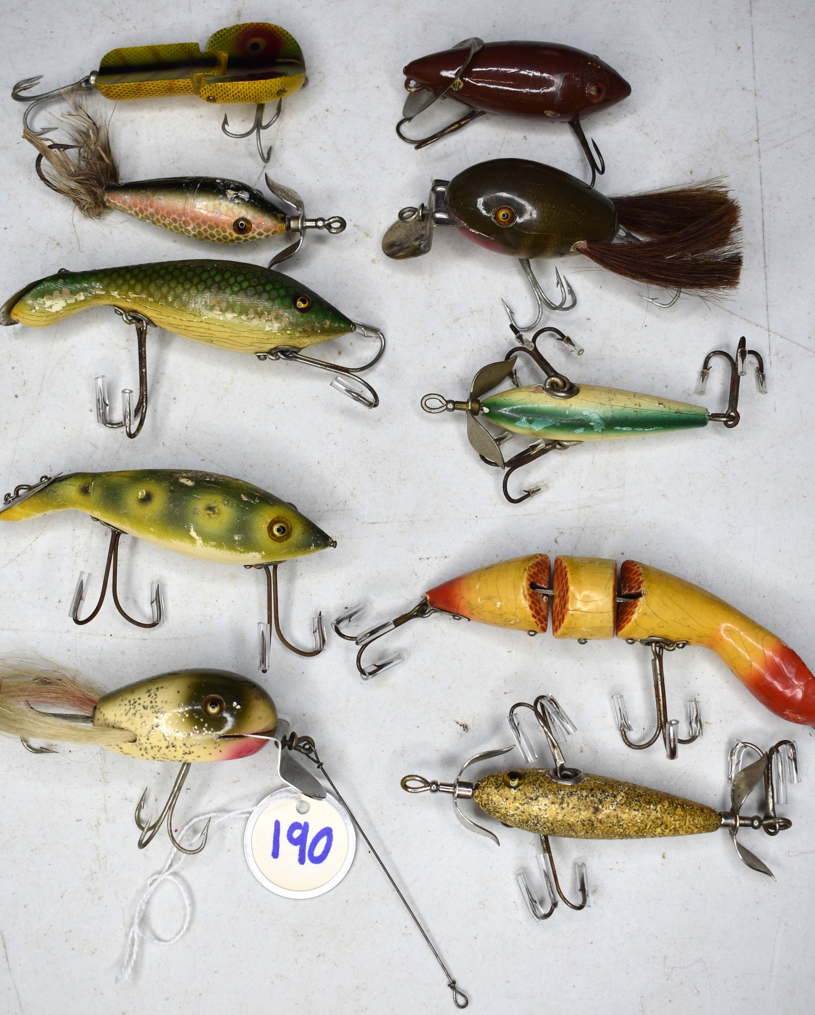Lot of 10 Vintage Fishing Lures Including Heddon Dowagiac & C.C.B Co.: Lot of 10 Vintage Fishing Lures Including Heddon Dowagiac & C.C.B Co. See attached photos as evidence of condition and details.