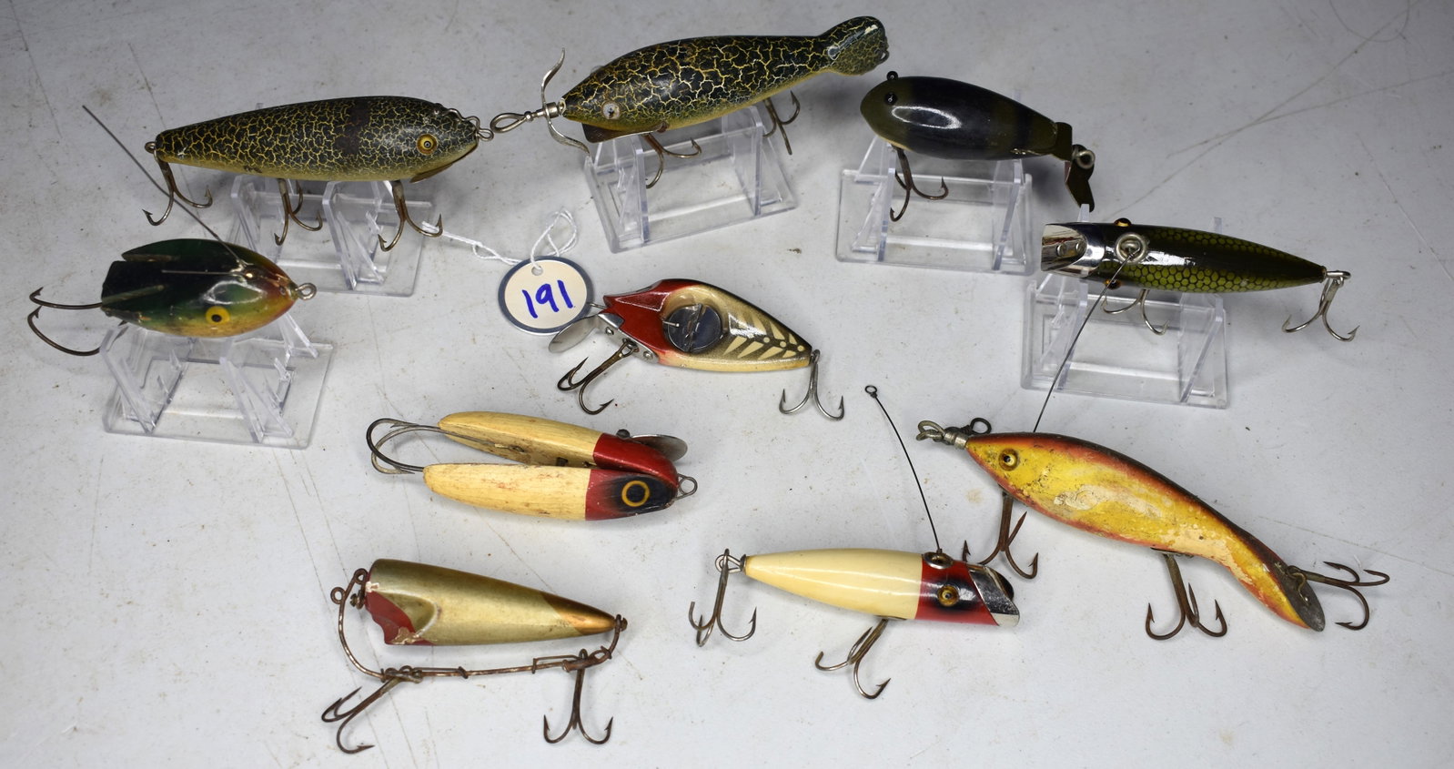 Lot of 10 Vintage Fishing Lures Including Heddon Dowagiac, C.C.B Co. and South Bend: Interesting Lot of 10 Vintage Fishing Lures Including Heddon Dowagiac, C.C.B Co. and South Bend. A few real good ones in here. See attached photos as evidence of condition and details.