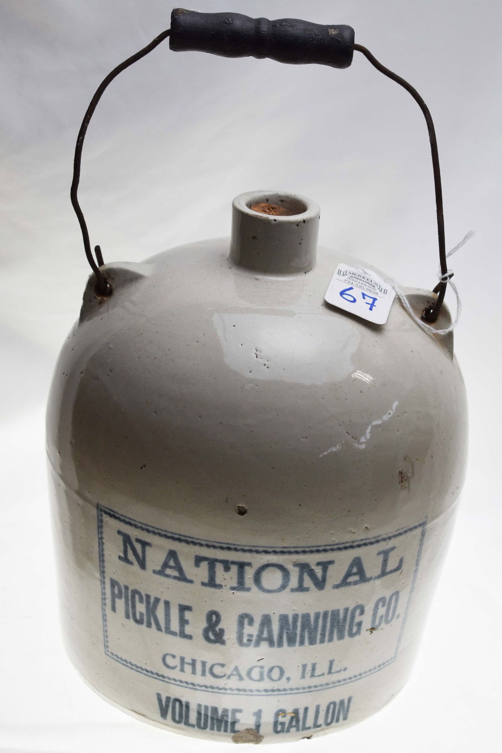 1 Gallon Stoneware Jug - National Pickle & Canning Co. - Chicago: Stoneware Jug - National Pickle & Canning Co.- Chicago. Jug says in Blue and in Blue Square: National Pickle & Canning Co. Chicago, ILL. outside of blue square it says: Volume 1 Gallon. Comes with ori