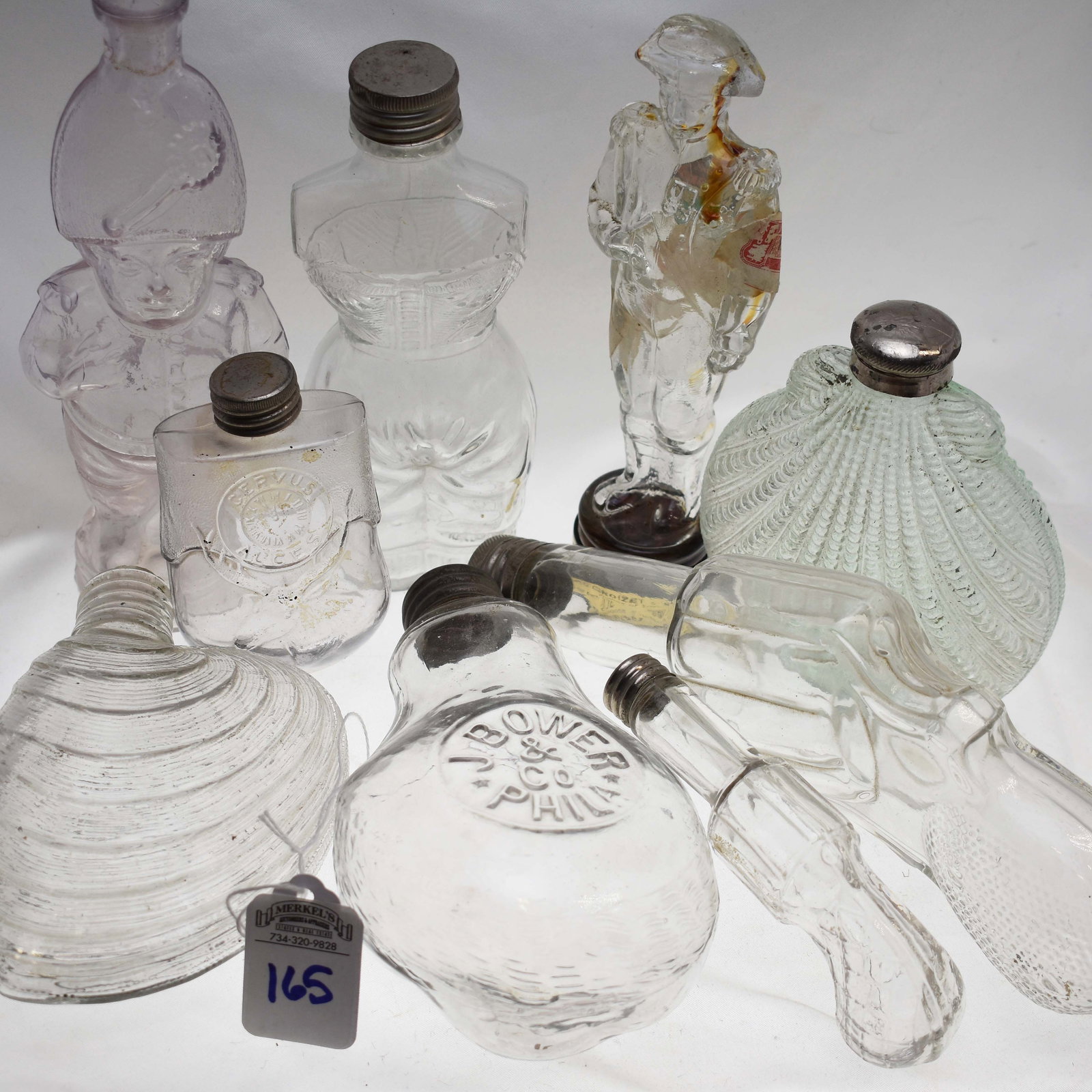 Lot of 9 Figural Flasks: Lot of 9 Figural Flasks. See Photos for More Detail and Description.