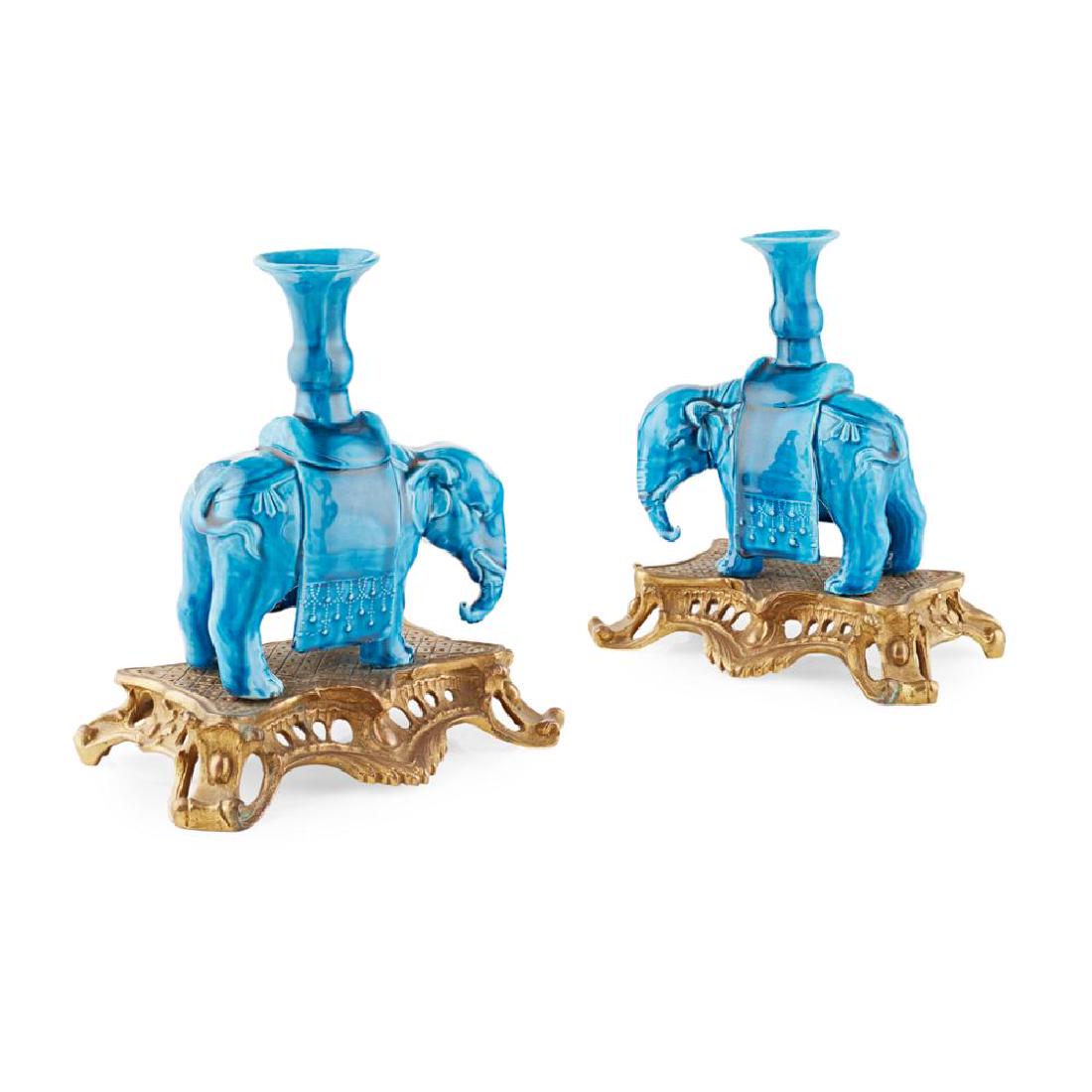 PAIR OF FRENCH GILT BRONZE MOUNTED CHINESE PORCELAIN: 19TH CENTURY in turquoise glaze, with everted openings raised on the elephants' backs, on French rococo style gilt bronze bases with pierced aprons on scrolled legs (2) 24cm high