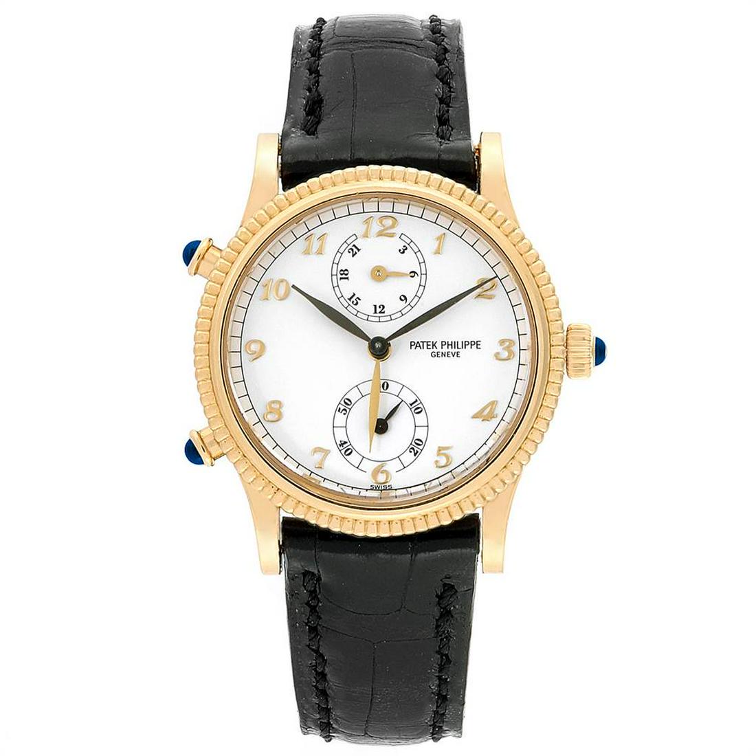 Patek Philippe Calatrava Travel Time: Brand: Patek Philippe Model: Calatrava Travel Time Case Size: 29.0 mm Movement: Manual winding Complications: Seconds, Second time zone Material: 18k yellow gold Band: Black strap with 18K yellow gold