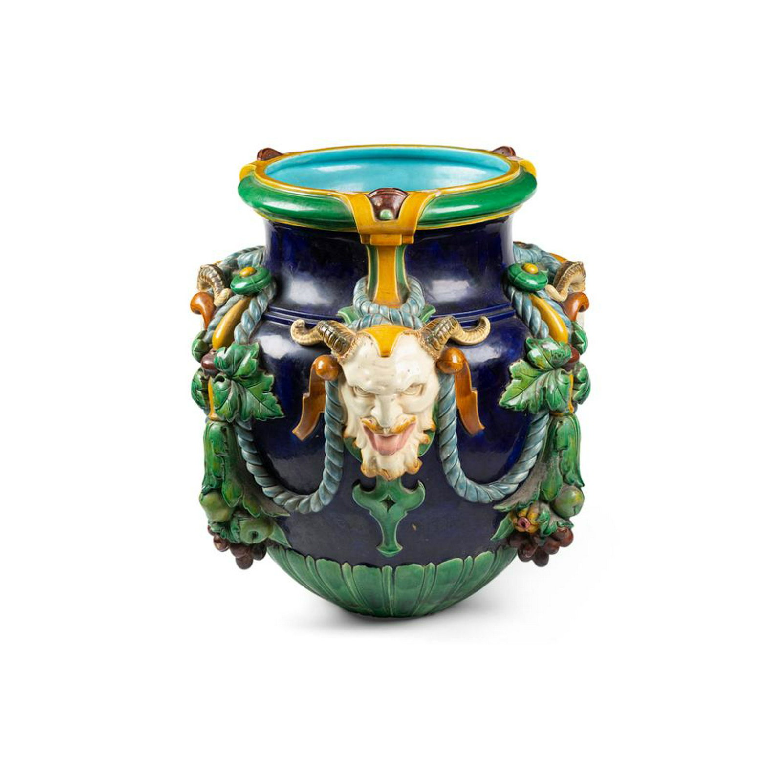 LARGE MAJOLICA JARDINIÃˆRE, ATTRIBUTED TO MINTONS: 19TH CENTURY of squat urn-form moulded with satyr masks and rope festoons with fruiting pendants against a cobalt ground, with a turquoise interior 64cm diameter, 66cm high