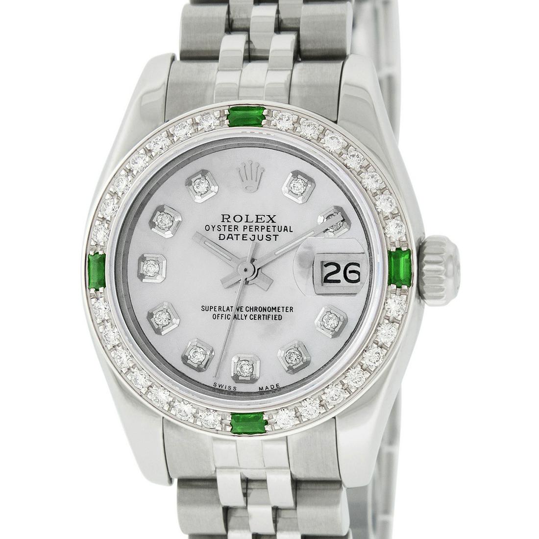 Rolex Ladies Datejust Watch SS & 18K White Gold Silver: Rolex 179160 Ladies Datejust 26mm Stainless Steel with Custom Silver Dial set with aftermarket Diamond Hour Markers. Custom 18K White Gold Bezel with Genuine Diamonds/Emerald. Rolex Automatic Movement