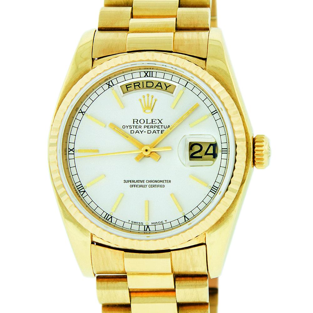 Rolex Mens Day-Date President Watch 18K Yellow Gold: Rolex Mens Day-Date President 36mm 18K Yellow Gold with Rolex Silver Dial set with Index Hour Markers. Rolex 18K Yellow Gold Fluted Bezel. Rolex Automatic Movement with Scratch Resistant Sapphire Crys