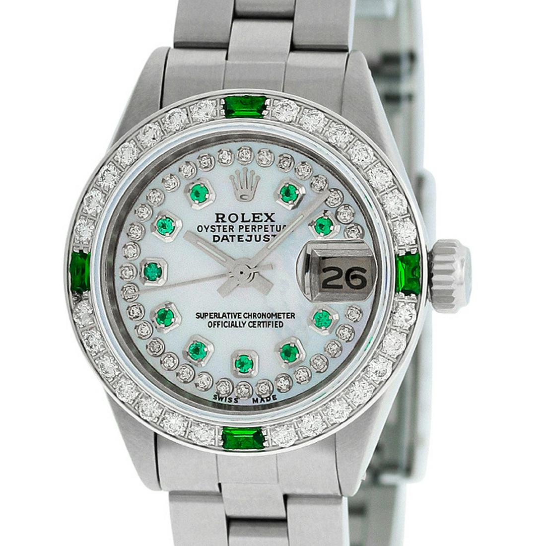 Rolex Ladies Datejust Watch SS & 18K White Gold MOP: Rolex Ladies Datejust 26mm Stainless Steel with Custom MOP Dial set with aftermarket String Diamonds and Emerald Hour Markers. Custom 18K White Gold Diamond/Emerald Bezel. Rolex Automatic Movement wit