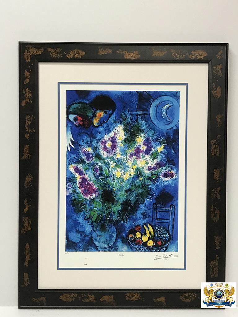 After Marc Chagall Still Life With Flowers Lithograph: After Marc Chagall (1887-1985 French) signed Lithograph. Numbered edition 52 of 500 on acid free archival paper. Stone signed lower margin with seal and stamp. Paper size 17 x 25 inches. Unframed/Fram