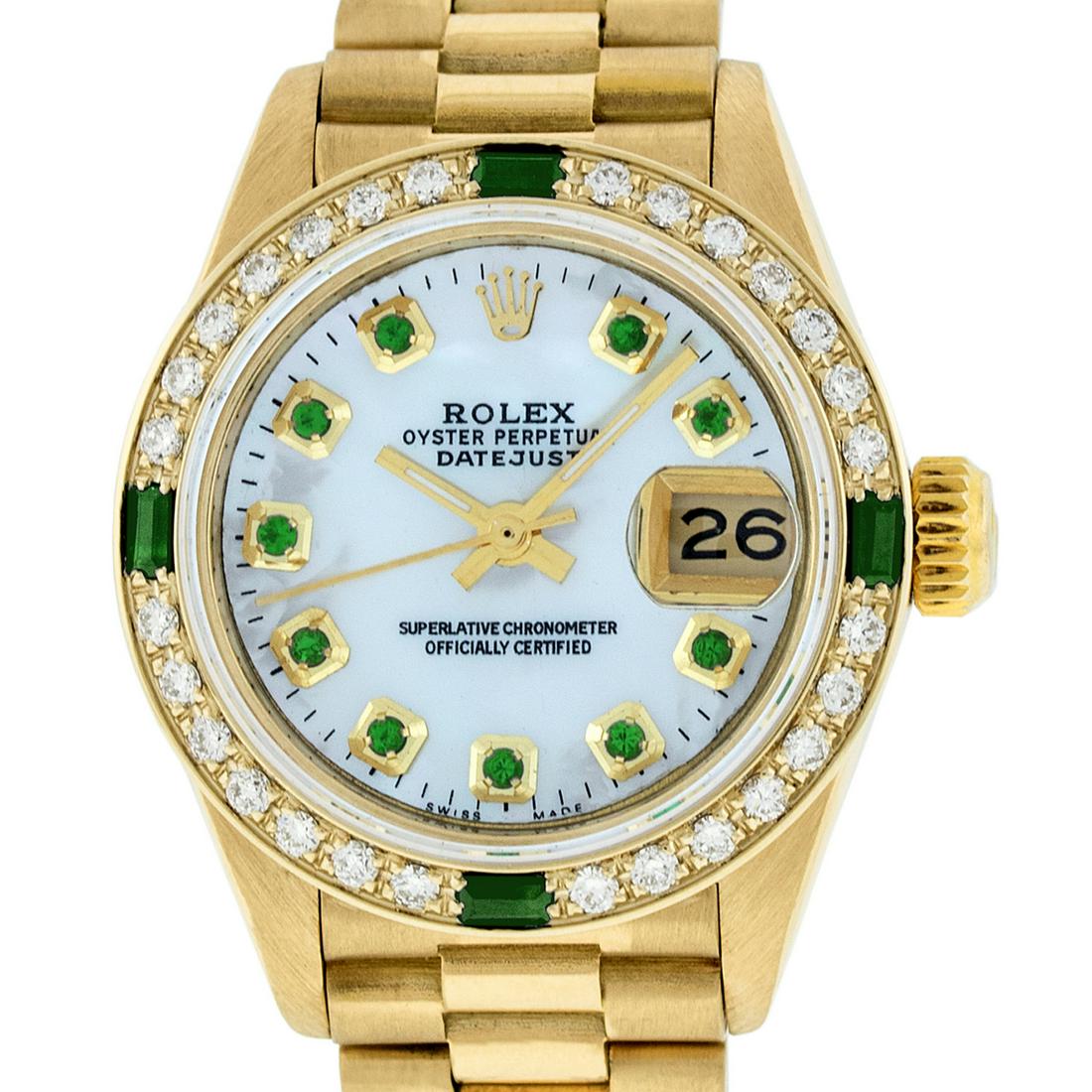 Rolex Ladies Datejust Watch 18K Yellow Gold MOP Emerald: Rolex Ladies Datejust 26mm 18K Yellow Gold with Custom MOP Dial set with aftermarket Emerald Hour Markers. Custom 18K Yellow Gold Bezel with Genuine Round Diamonds and 4 Emerald Baguette. Rolex Automa