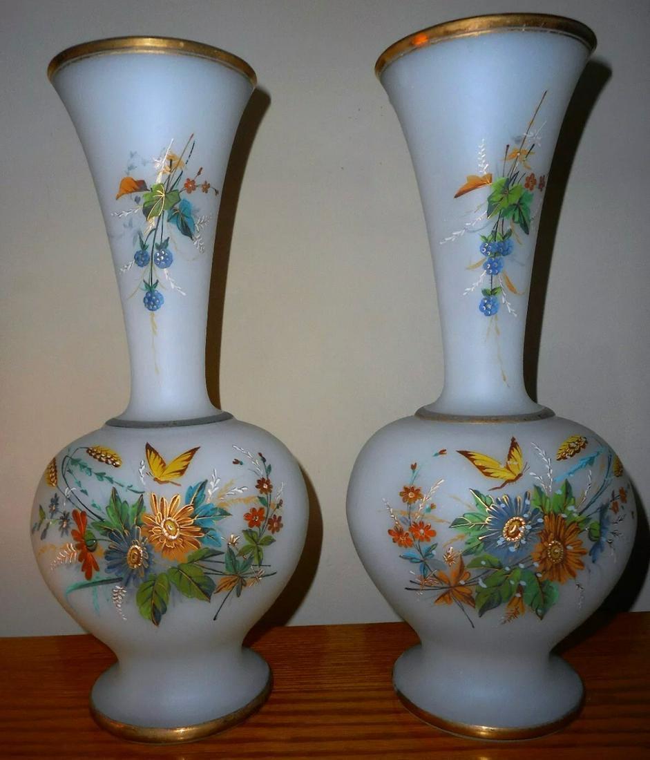 PAIR OF LARGE OPALINE VASES: Description: Pair of Large Opaline vases. The enameled flowers are multi colored and include a butterfly on each. The blown glass is an opaque white and would be outstanding on a mantle or buffet. The