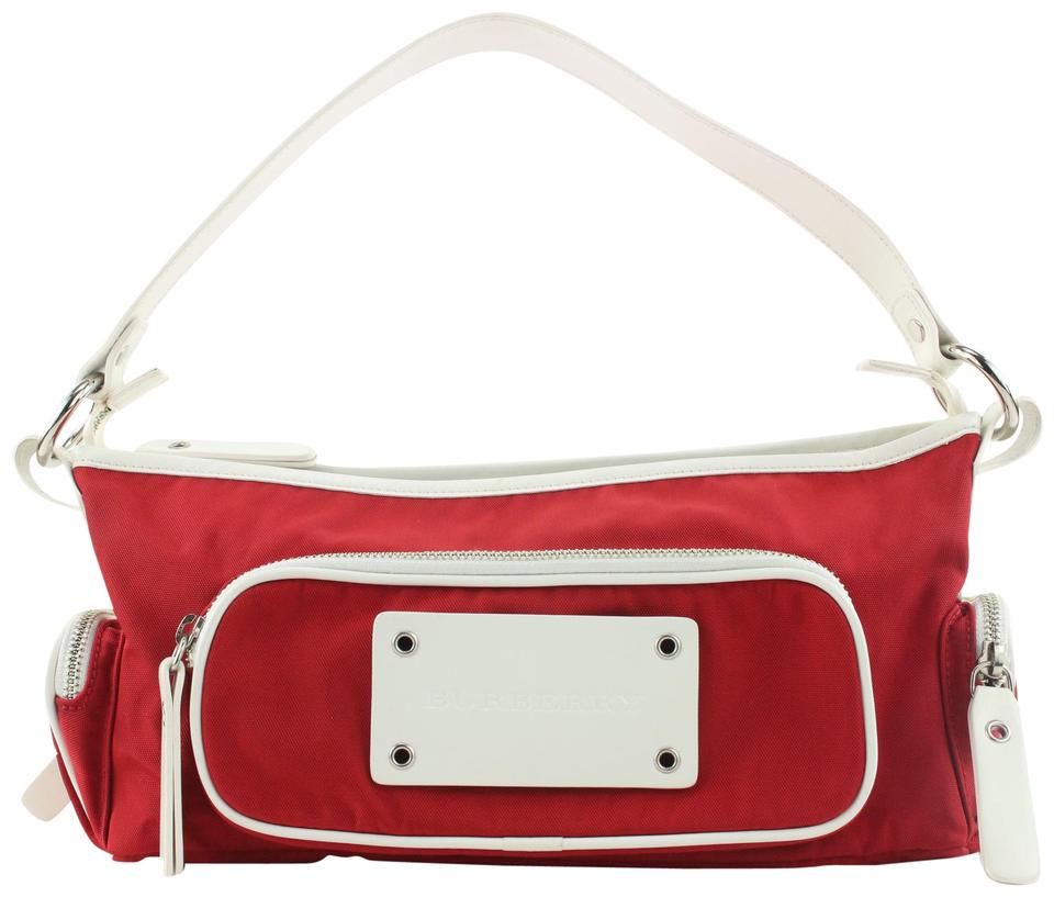 Burberry London Red Shoulder Bag: Brand: BURBERRY LONDON Strap: 7" Measurements: Length: 13" Width: 4" Height: 6"