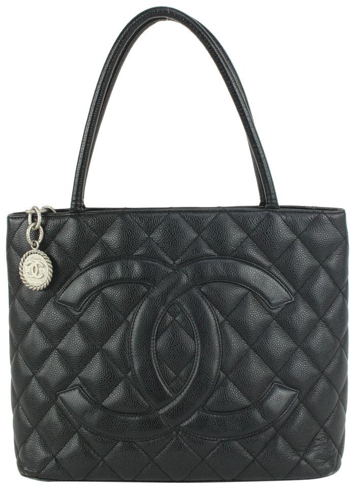 Chanel Black Quilted Caviar Leather Medallion Tote Bag: Brand: CHANEL Strap: 6.5" Measurements: Length: 13" Width: 5.5" Height: 9.5"