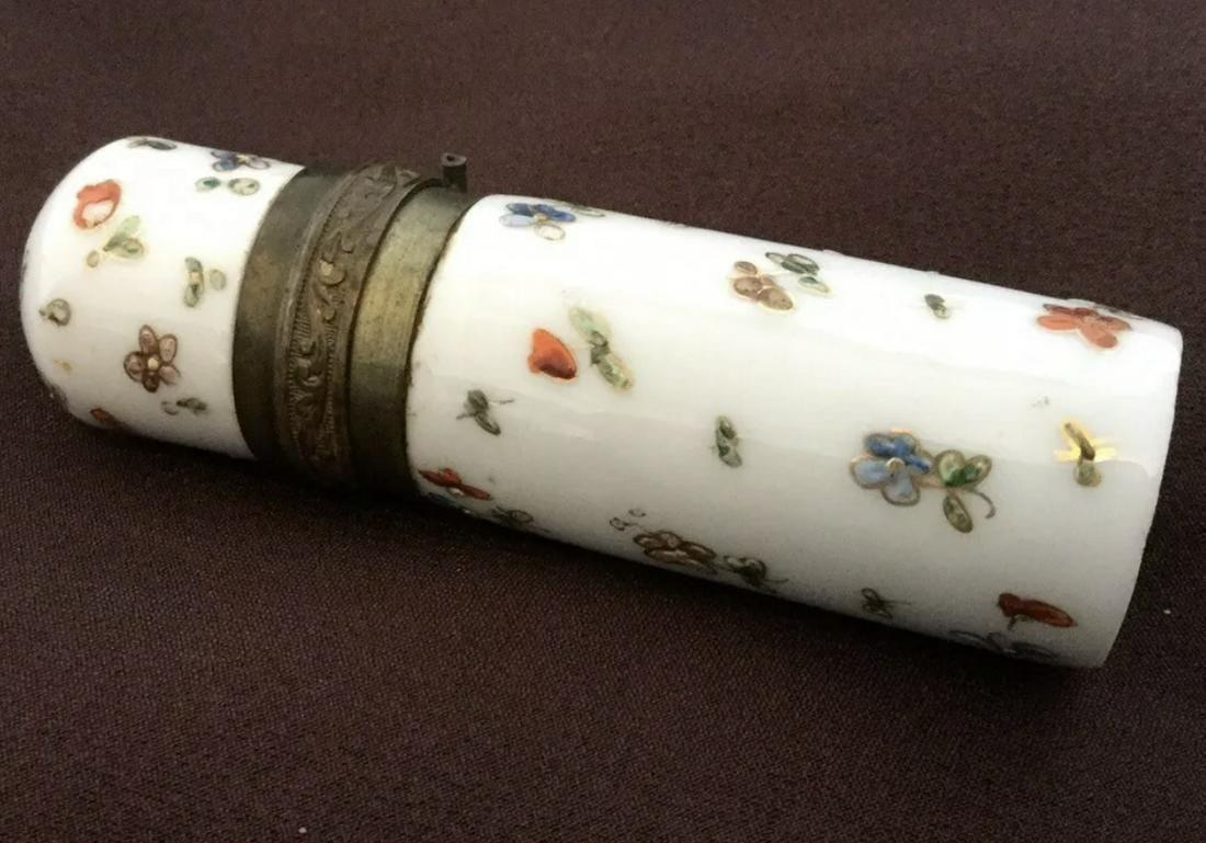 PERFUME SCENT BOTTLE CHATELAINE CERAMIC ENAMEL FLASK: Description: Perfume scent Bottle Chatelaine Ceramic Enamel FlasK. Flower decor. Lid open and closes great, brass center design Measurement: 3" long by 1" wide.