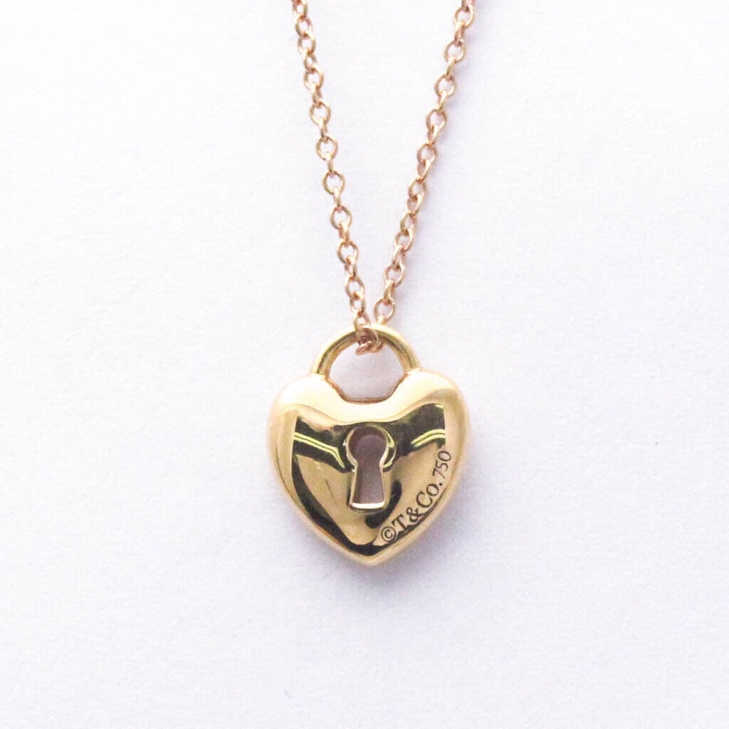 TIFFANY HEART LOCK 18K ROSE GOLD PENDANT NECKLACE: Brand: Tiffany & Co. Type: Pendant necklace Material: 18K Rose Gold Weight: 3.1g / 0.1oz. Neck Circumference: 40 cm / 15.74'' Pendant Size: 11.2mm x 9.3mm / 0.44'' x 0.36'' Accessories: Box, Dust bag