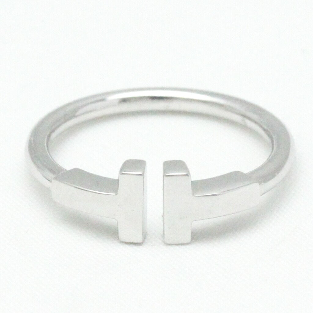 TIFFANY T WIRE 18K WHITE GOLD RING: Brand: Tiffany & Co. Type: Band ring Material: 18K White Gold Ring size: 6 Other Size: 11 Width: 15.2mm / 0.6'' Weight: 3.6g / 0.12oz.