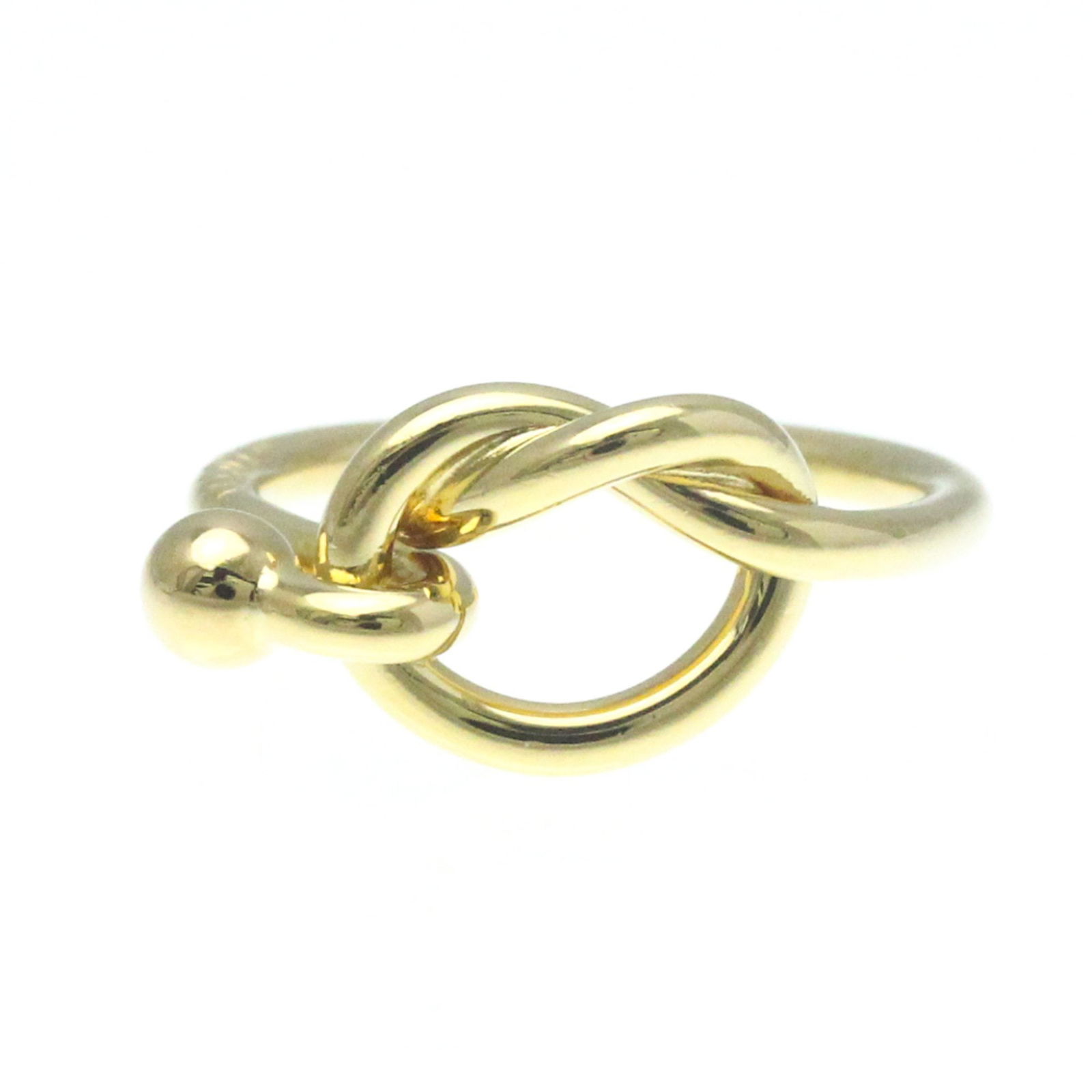 TIFFANY KNOT RING (18K) FASHION RING: Tiffany Knot Ring (18K) Fashion Ring Brand: Tiffany Type: Band ring Material: Yellow gold (18K) Color: Gold Size: 7 1/4 Accessories: None Accessories Notice: When purchasing pre-owned goo