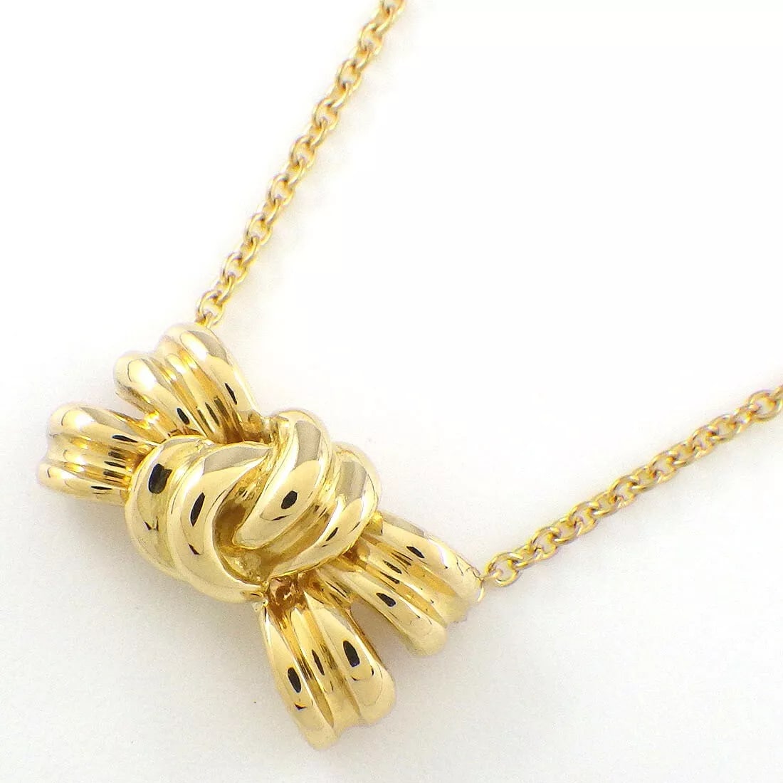 Tiffany & Co. Necklace Bow Motif Ribbon 750(18K): Tiffany & Co. Necklace Bow Motif Ribbon 750(18K) Brand: Tiffany & Co. Type: Necklace Material: 750(18K) Yellow Gold Color: None Size: Chain Length : 16.37"(inches) / 41.6cm, Motif Size : W 0.57" × H 